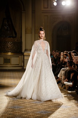 A-Line Gown with Deep V-Neckline, Cape by Berta berta-spring-summer-2018-a-line-dress-full-skirt-heavy-embellishments-illusion-cape
