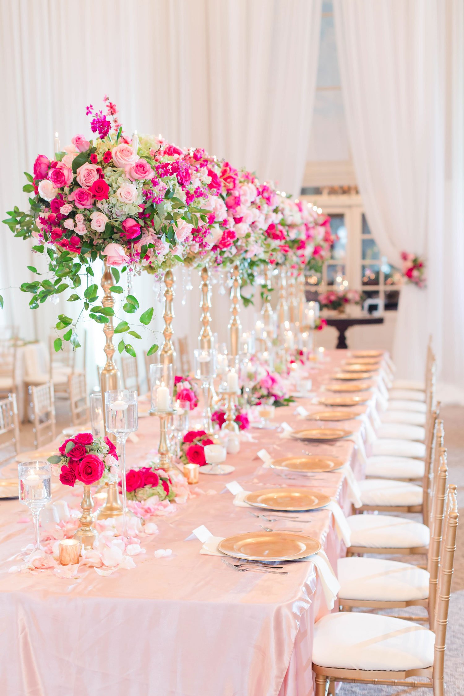 Long Table with Tall Pink Flower Arrangements