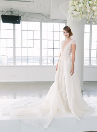 Look 2 by Marchesa Bridal FW18 marchesa-bridal-fall-2018-collection-wedding-dress-cap-sleeve-gown-with-over-skirt-detachable-v-neck