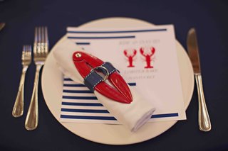 Lobster Bake Place Setting nantucket-rehearsal-dinner-with-red-and-blue-decorations