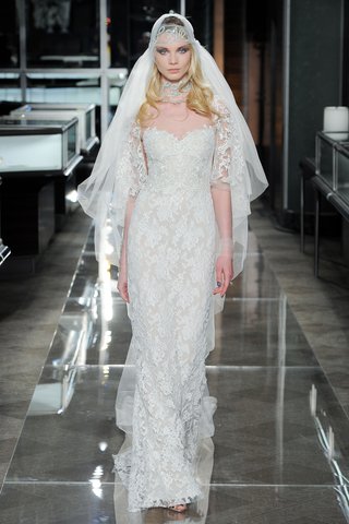 "Exquisite" by Reem Acra a-re-embroidered-lace-gown-with-an-embroidered-cape-sleeve-and-bodice-detail-by-reem-acra