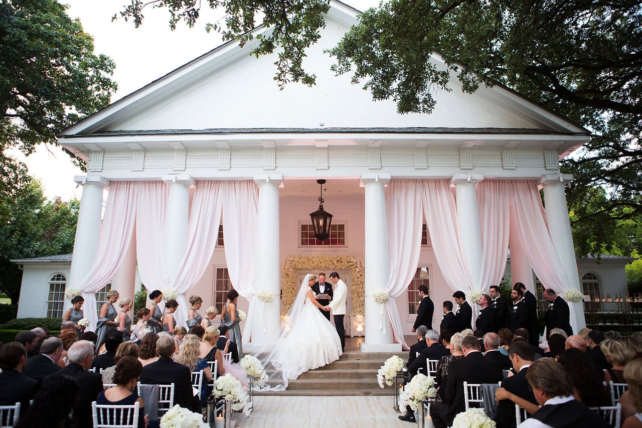 Bride & Groom on Porch of Venue