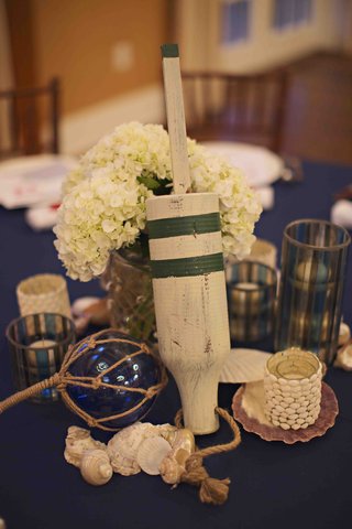 Wooden Buoy Centerpiece nautical-rehearsal-dinner-table-decorations