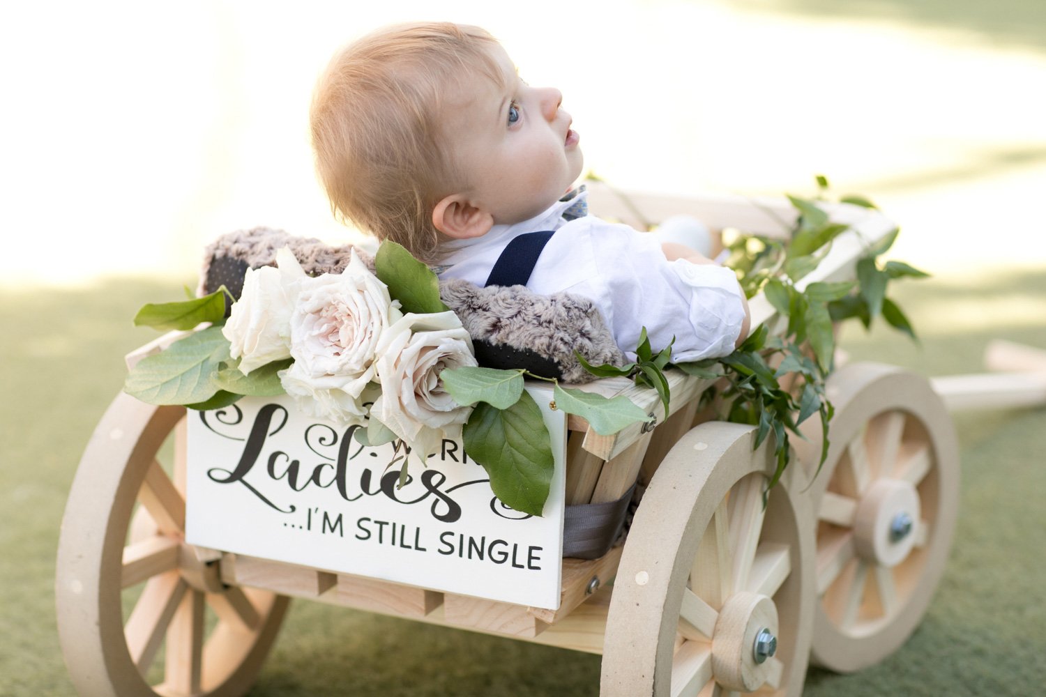 baby flower girl in wagon
